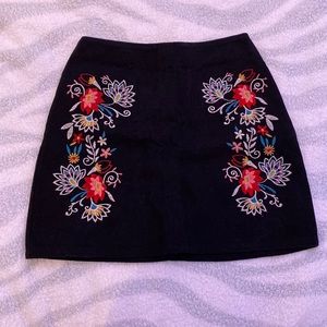 Cute flower patterned jean like material skirt.